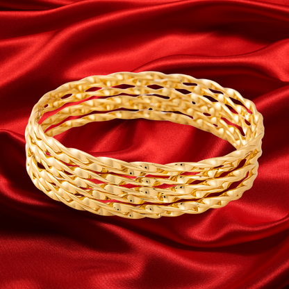 The Mosquito Coast 7 piece twisted Gold Plated Bangle Set
